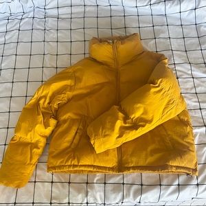 1nitial XL mustard yellow puffer jacket with tighteners at the bottom